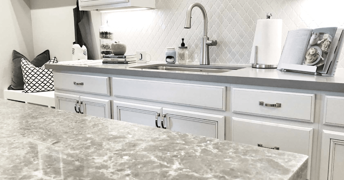 Quartz countertops in a kitchen that was designed by Jenuane.