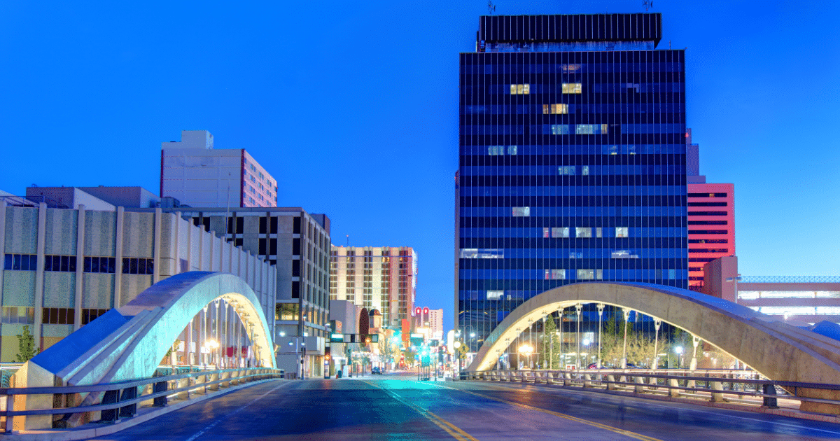 An overpass in Reno set in front of a skyscraper and deep blue skies.