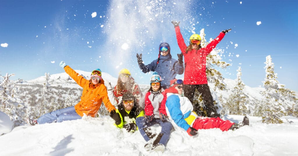 A group of people having fun in the snow.