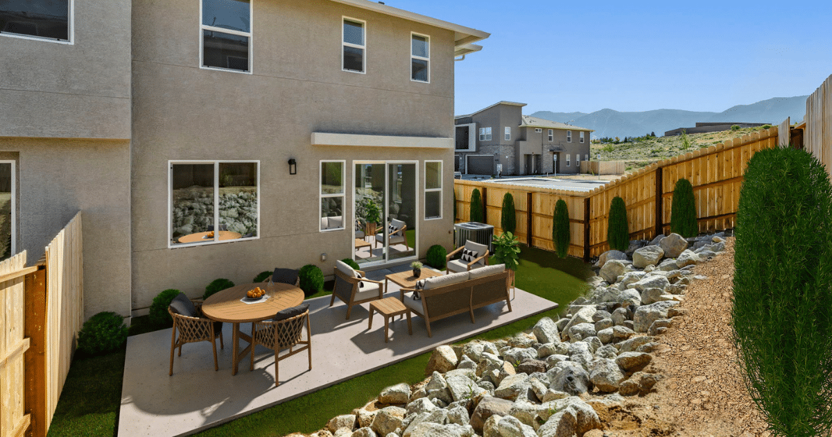 A backyard image of The Village South townhome-style condominium by Jenuane Communities.