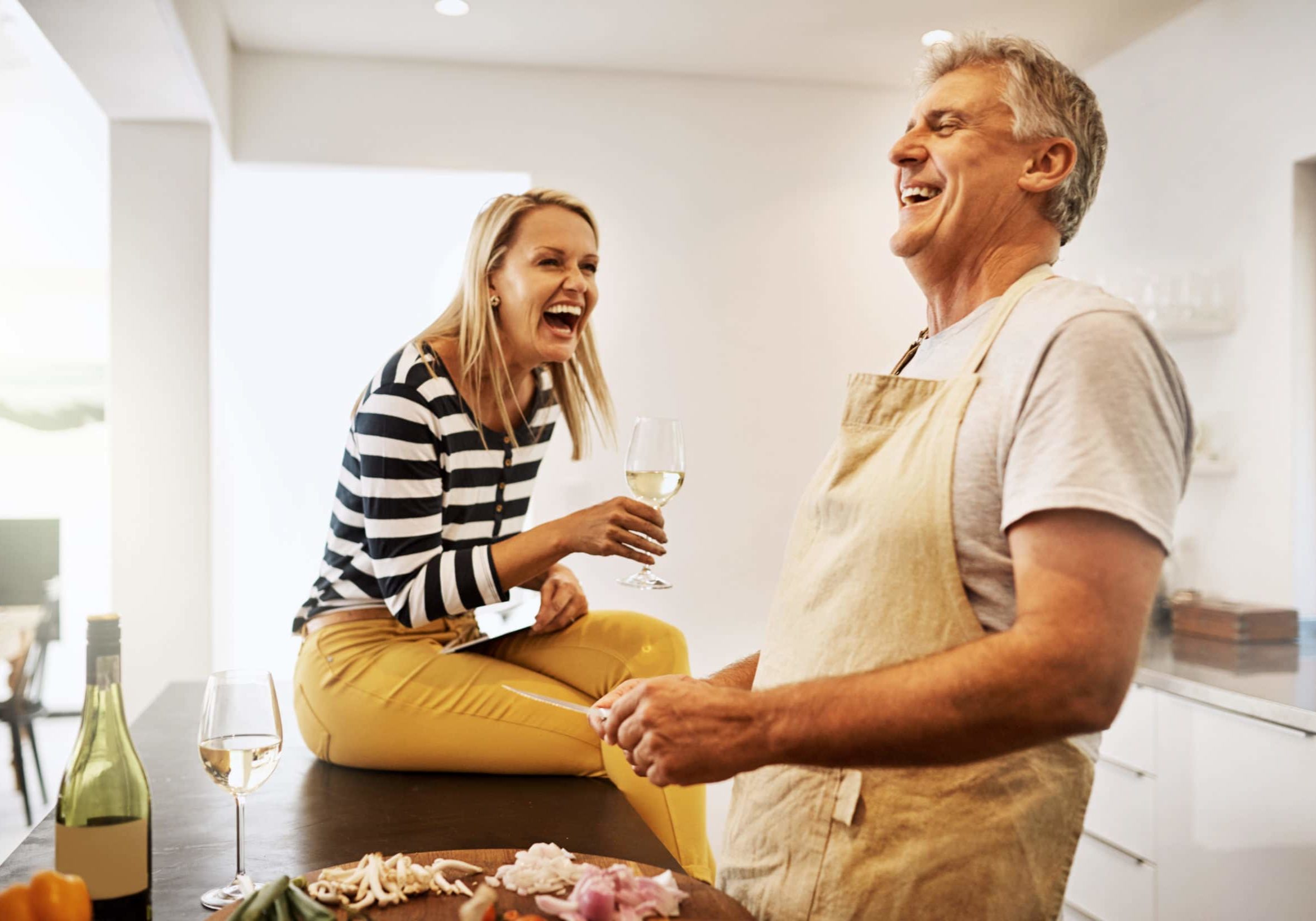 Shot of a happy mature couple keeping each other company in the kitchen